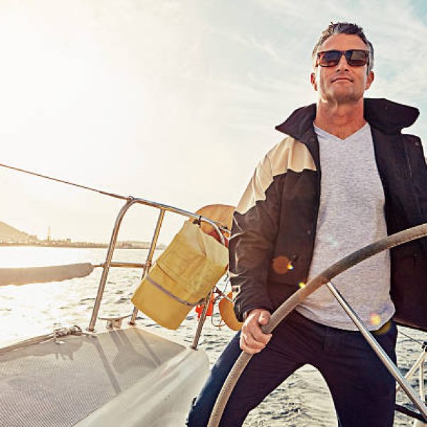 Shot of a man out on a boat trip alone Shot of a man out on a boat trip alone